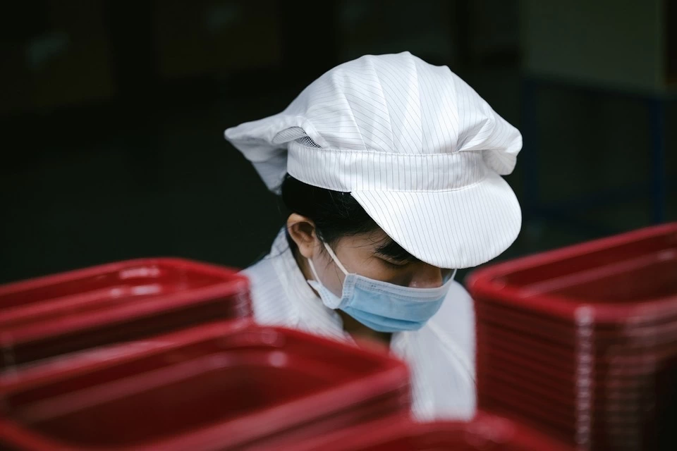 conscientious workers; image of woman packaging