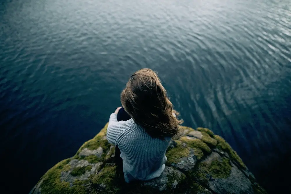 depth in fiction. image of woman looking at the sea